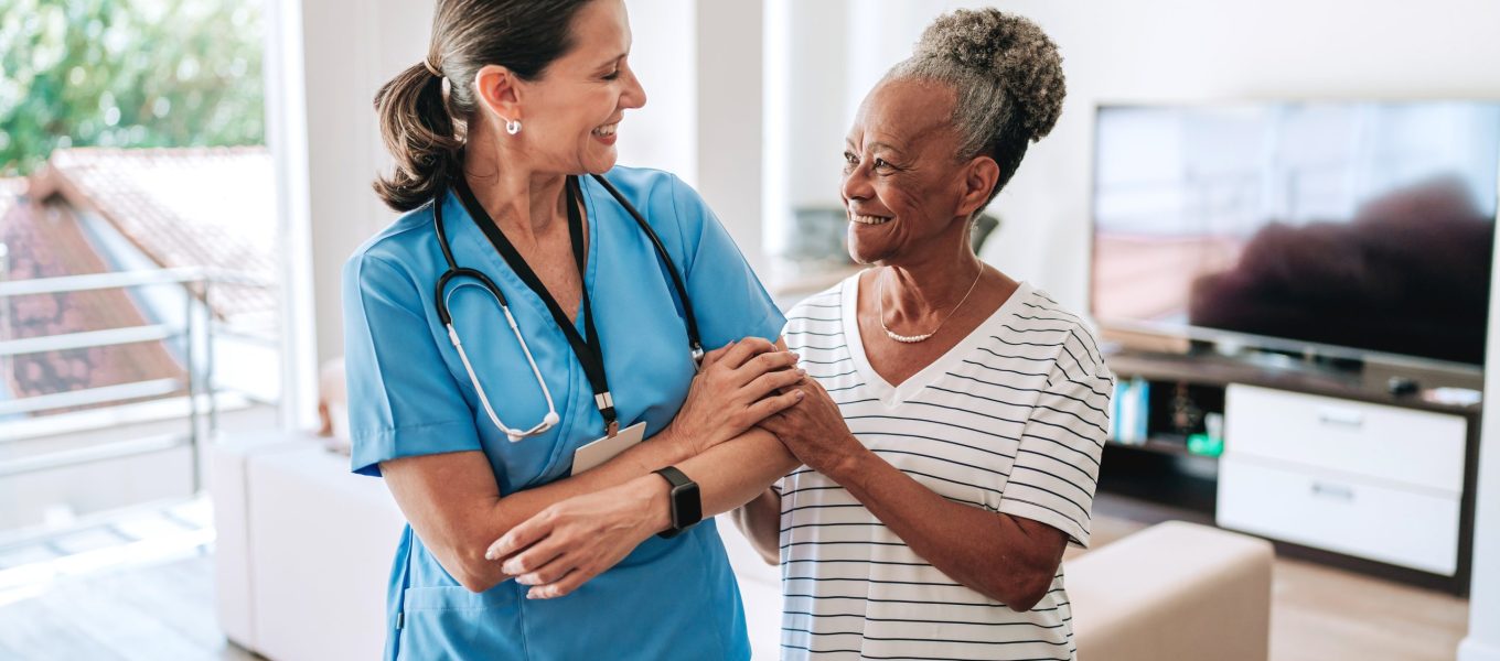 Home care healthcare professional hugging elderly patient Home care healthcare professional hugging elderly patient